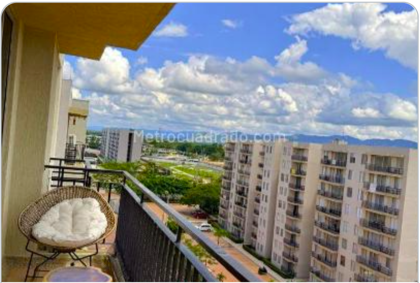 Apartamento en Paraíso - Vista desde balcón con edificios modernos y montañas
